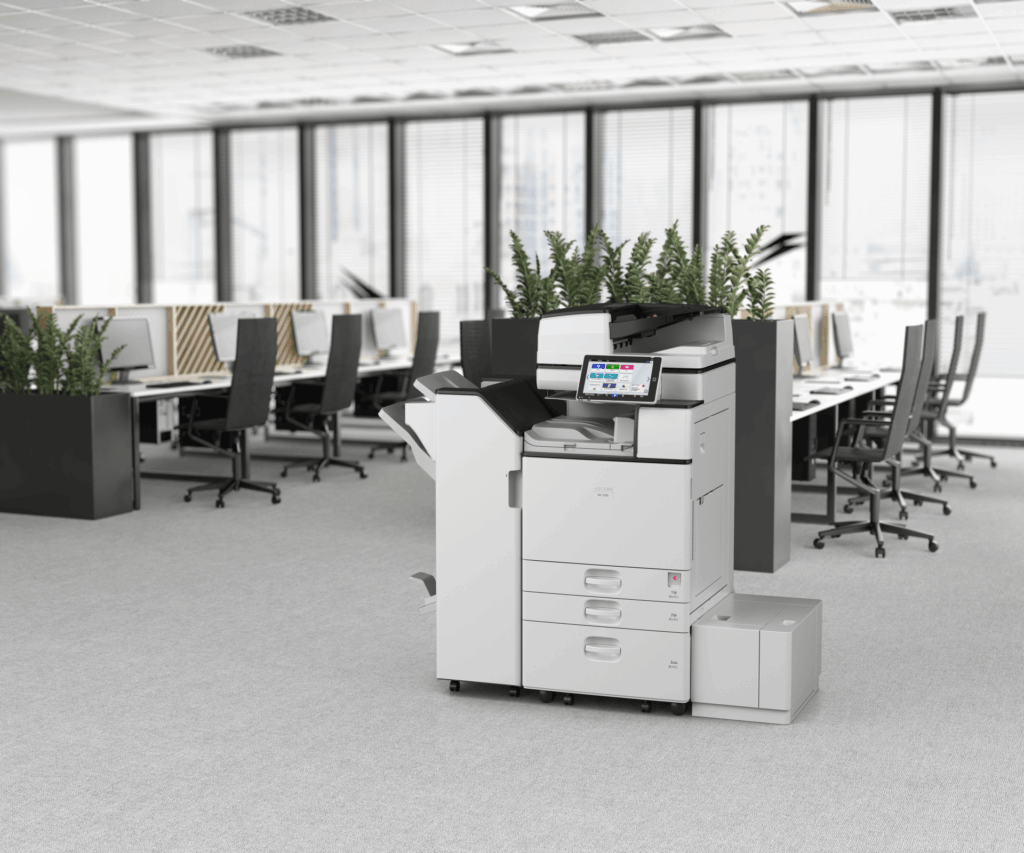 An office with a printer in the middle of it