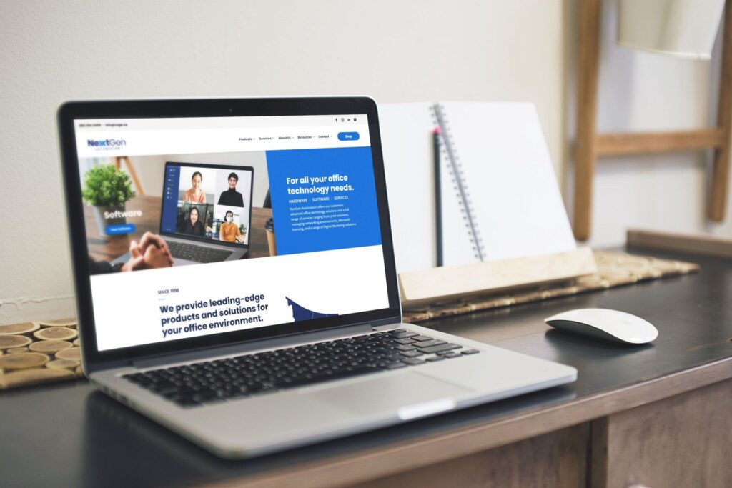 A laptop computer is open to a website on a desk.