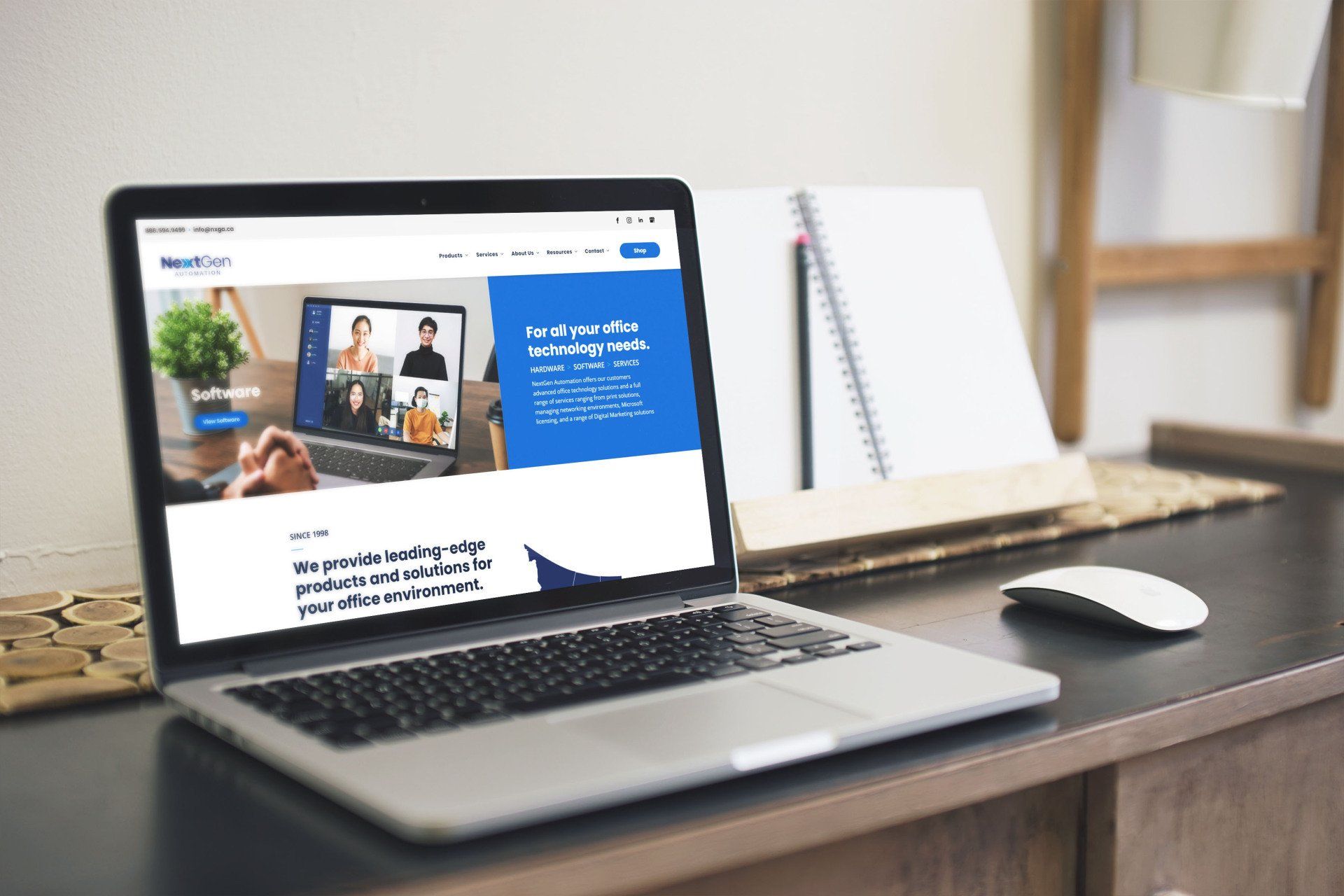 A laptop computer is open to a website on a desk.