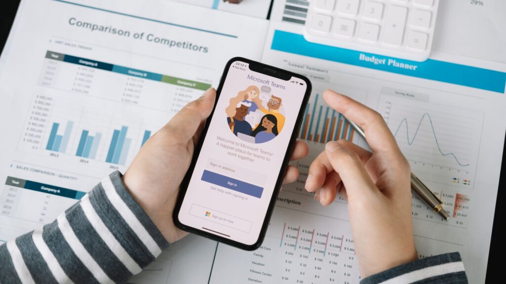 A person is holding a cell phone in their hands.