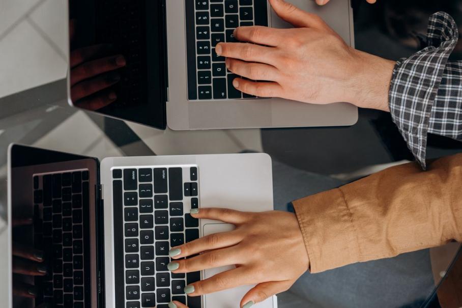 Professionals using laptops to provide responsive remote IT support and managed technology services for businesses across the BC Interior.