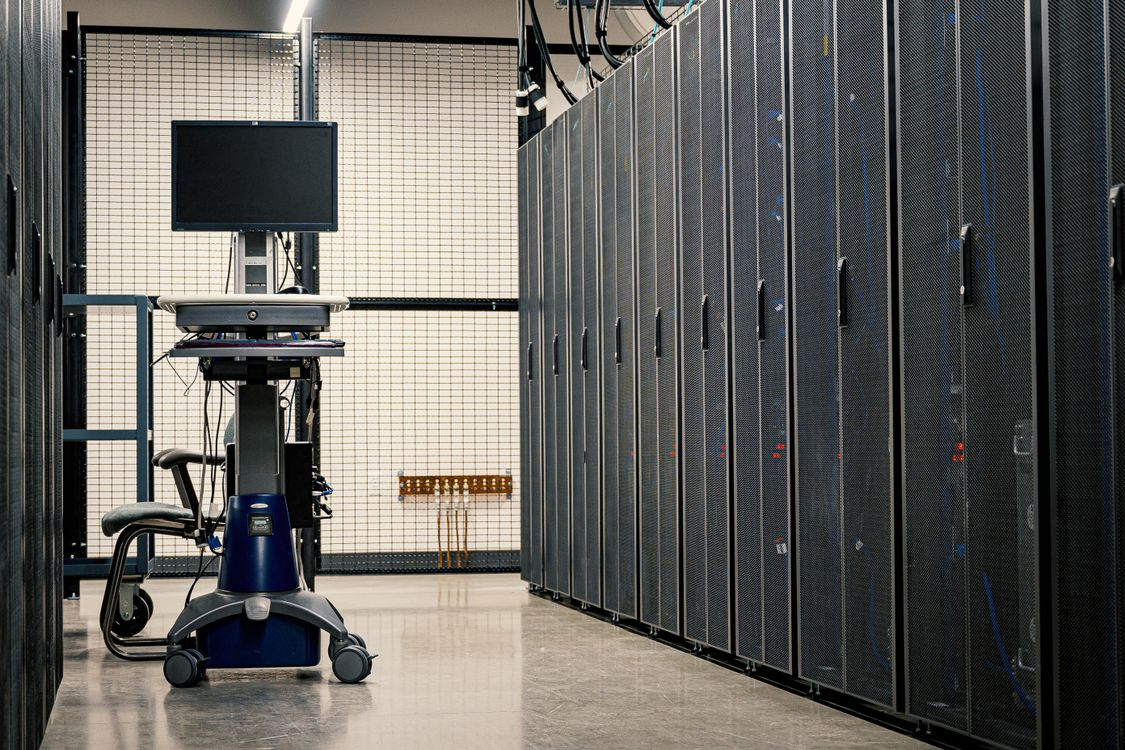 A data centre interior showcasing server racks and operational equipment supporting business continuity.